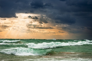 Warm sun rays and white-cap waves spill over on Lake Michigan