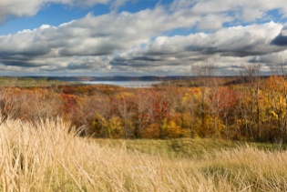 The Glen Lakes sit ensconced with the perfect wrappers of trailing clouds, dune grass, and fall colors - as seen from the Sleeping Bear Dunes
