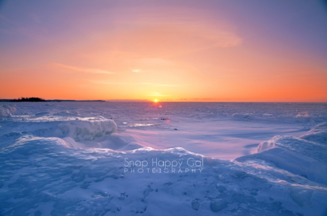 Photo: fiery sunset over frozen Lake Michigan, Northport