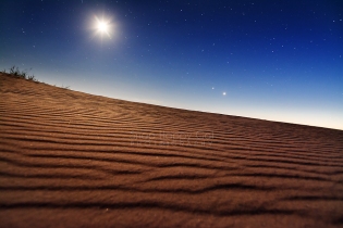 Photo: Moon and stars above undisturbed sand in the Sleeping Bear Dunes National Park
